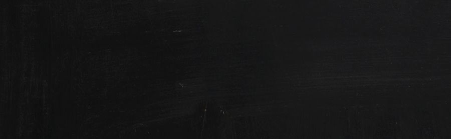 A hand drawing a website window on a blackboard